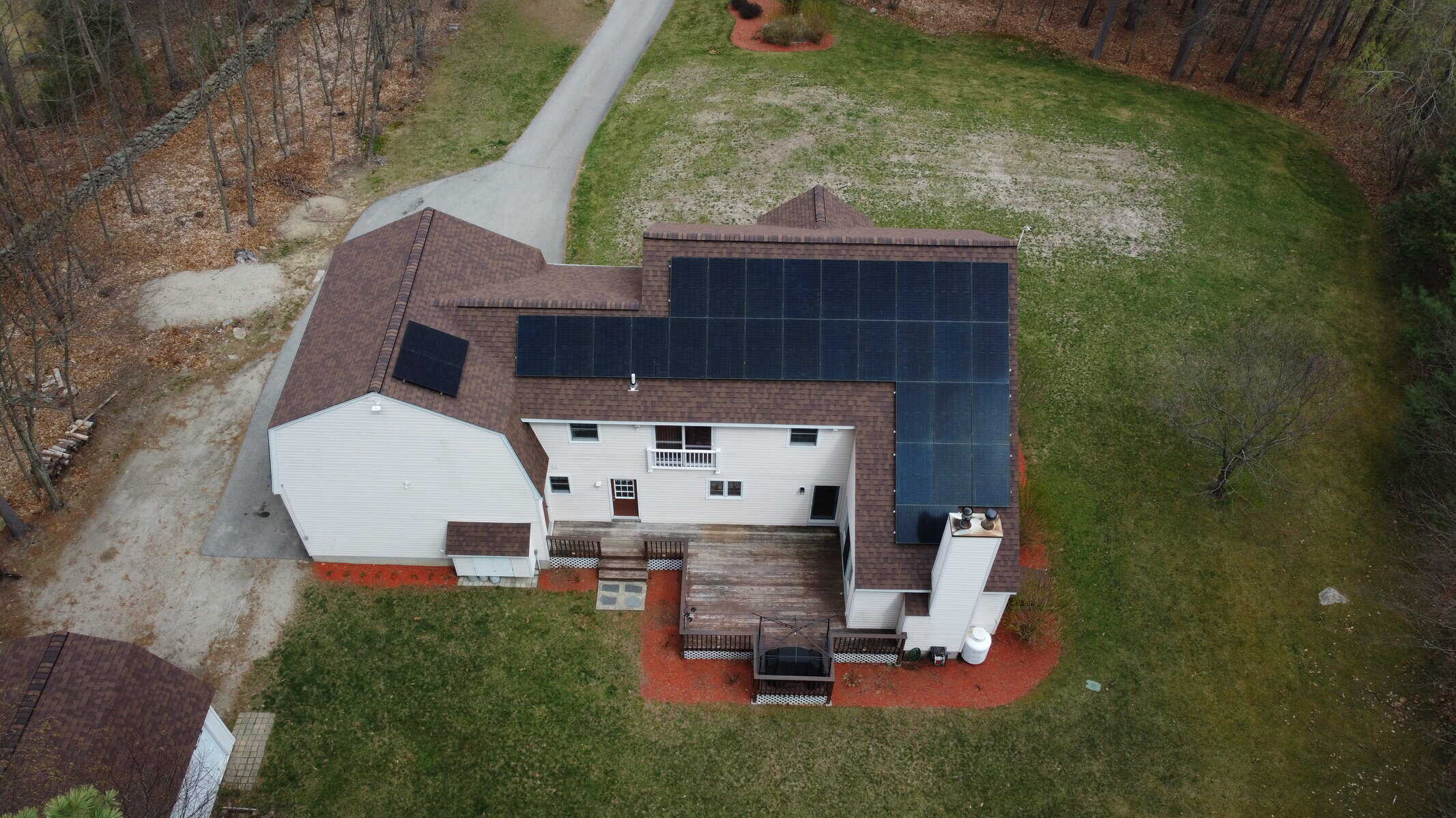 Solar panel installation on residential roof with backyard, showcasing renewable energy home solar system, eco-friendly solar power, and solar energy efficiency.