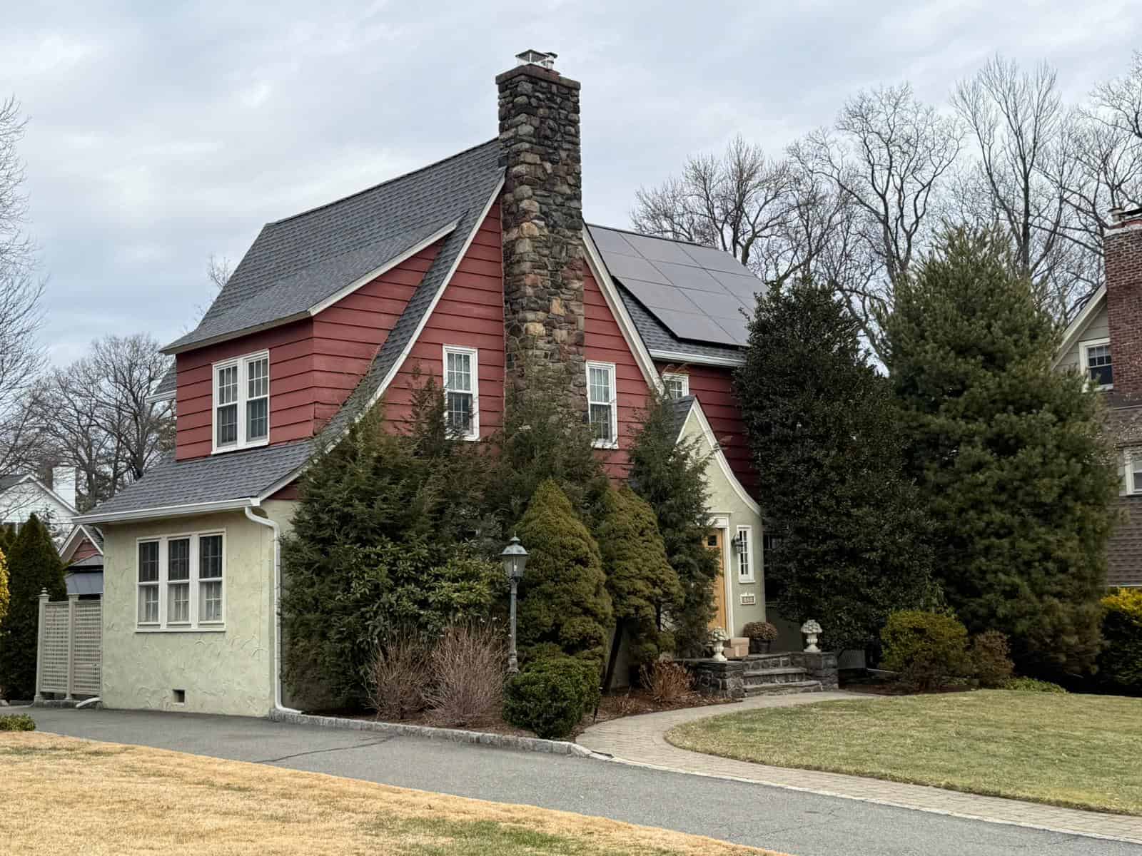 A rooftop solar installation on a New England home, turning unused roof space into steady, clean energy. The sleek black panels sit flush with the shingles, generating power year-round and helping the homeowners lower their electric bills without changing the look of their property.