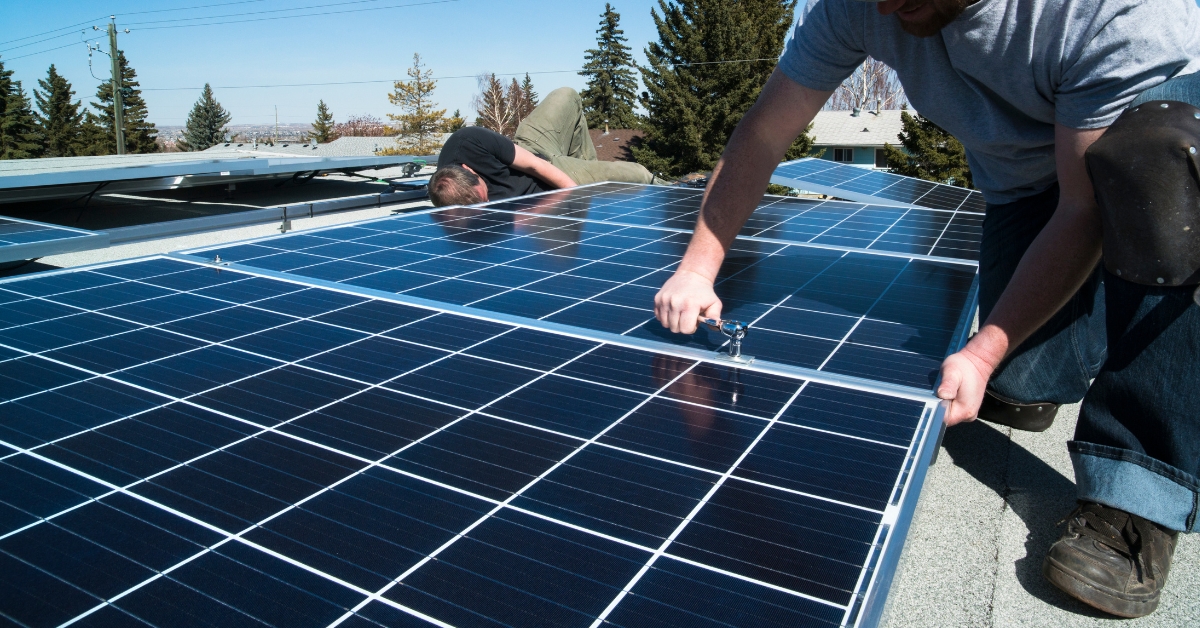 solar installation company installing solar panels on a roof in Massachusetts or Rhode Island
